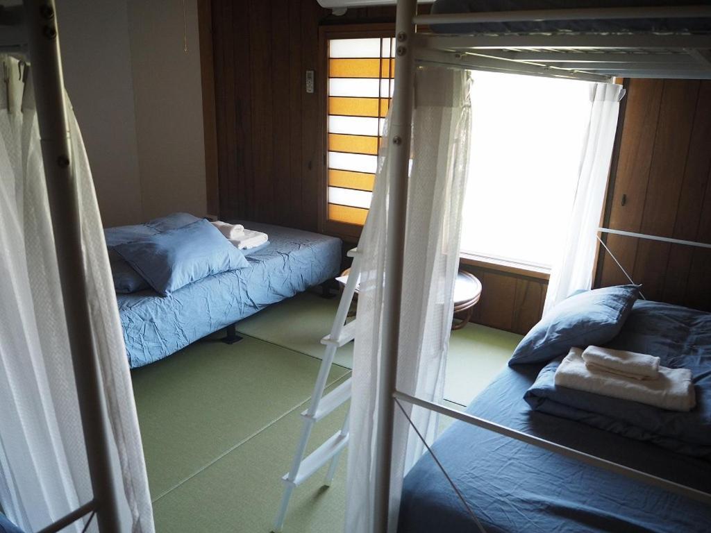 Guesthouse ＆ Beach Cafe Fuego Hyuga Ruang foto